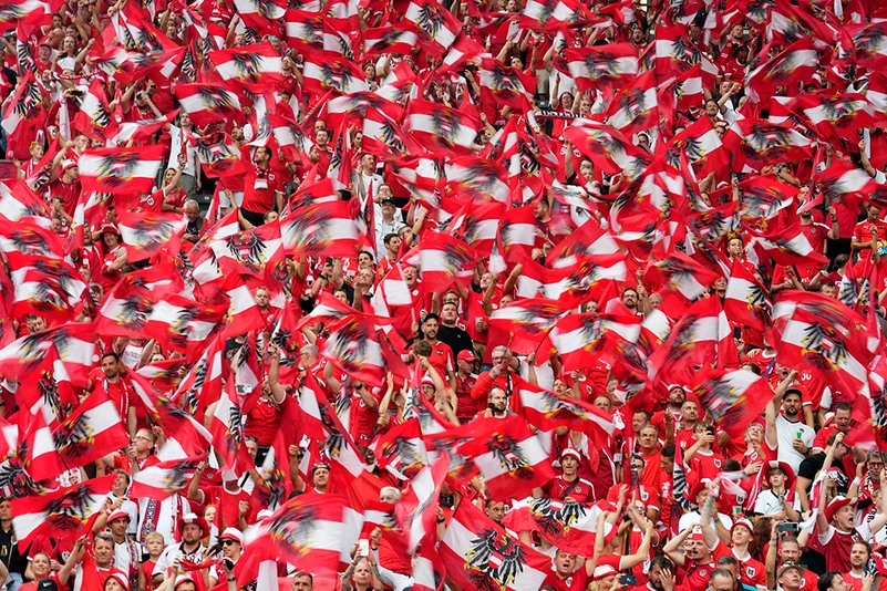 Austrian fans cheer for their team